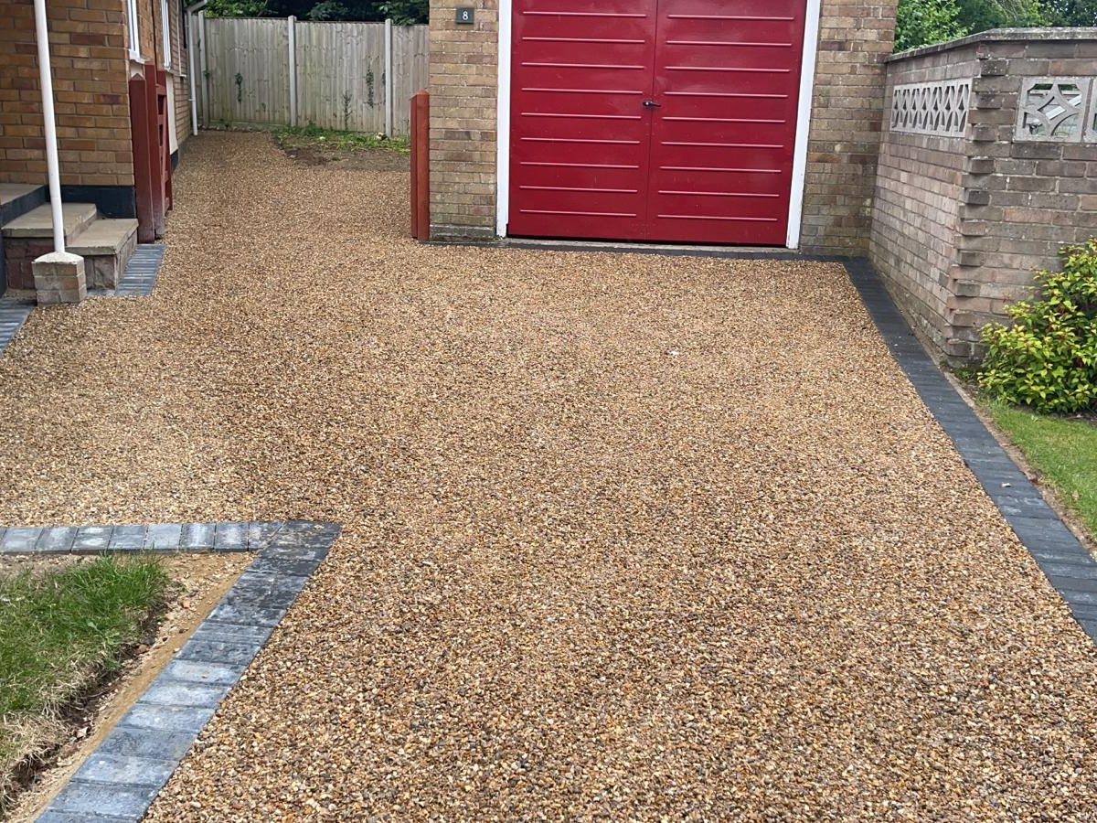 Gravel Driveway Leading to House and Garage